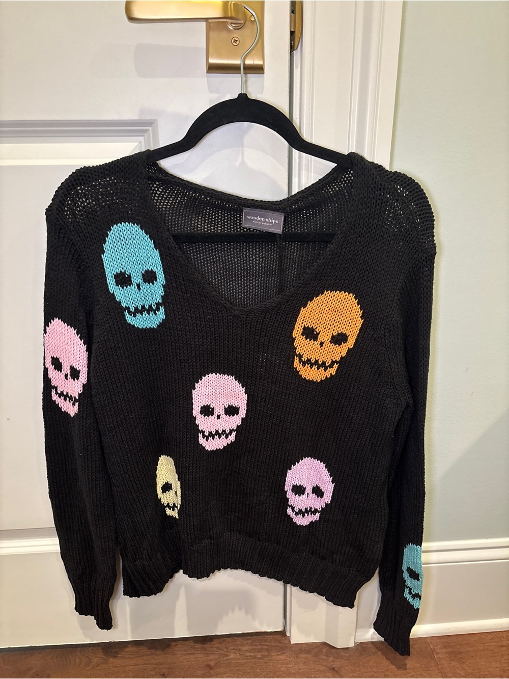 Wooden Ships Black V-Neck Sweater with Neon Skull Motif